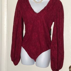 EXPRESS burgundy lace body suit with v-neck and puffed sleeves